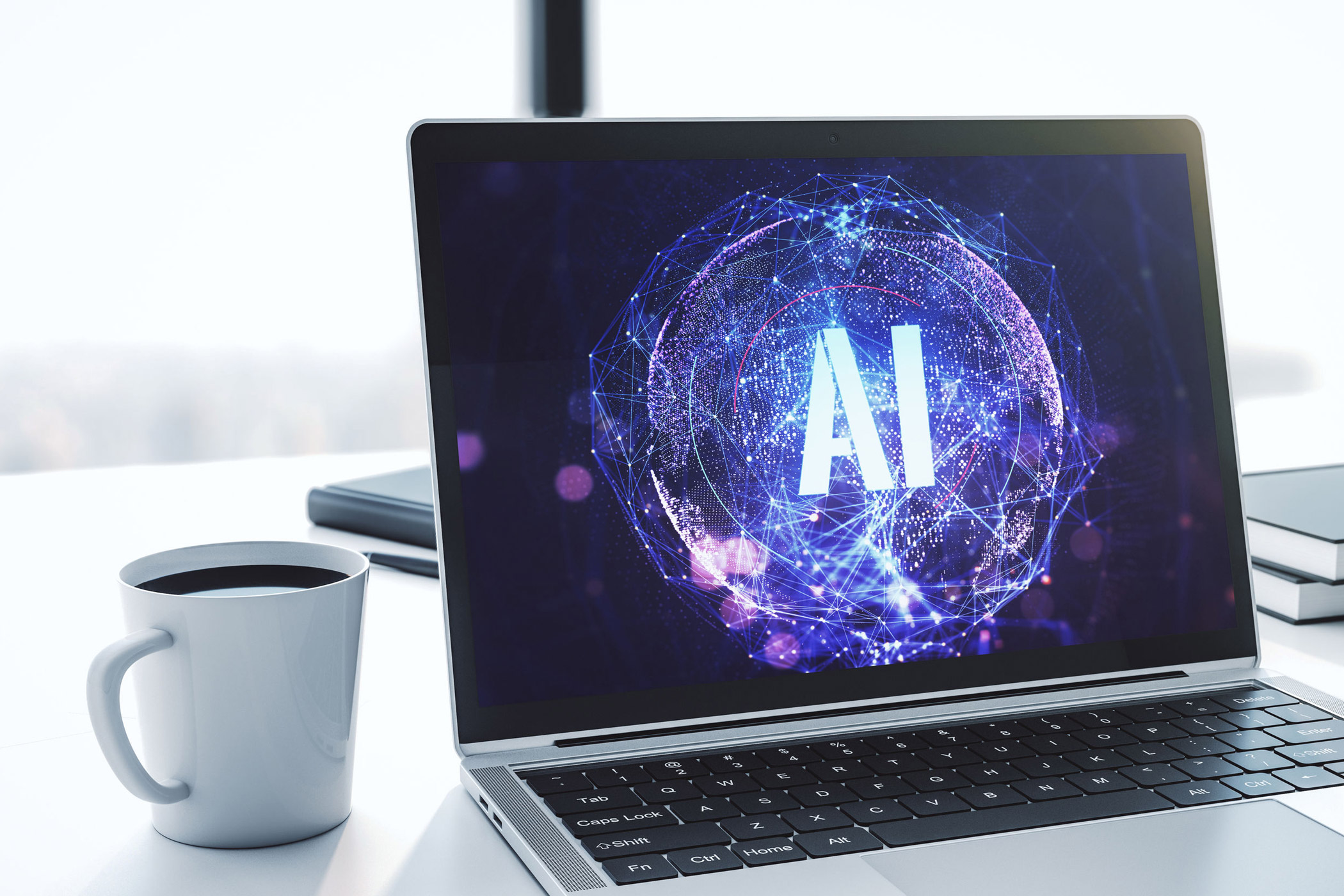 So verändert KI das Suchverhalten / auf dem Foto: Auf einem Schreibtisch steht neben einer Tasse Kaffee ein Notebook, auf dessen Display eine Darstellung eines neuronalen Netzes und die Buchstaben "AI" zu erkennen sind.